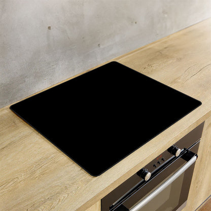Inductie beschermer zwart effen op de inductie plaat in de keuken